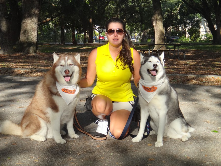 Katt Neuwirth with two Siberian Huskies at a South Broward County park